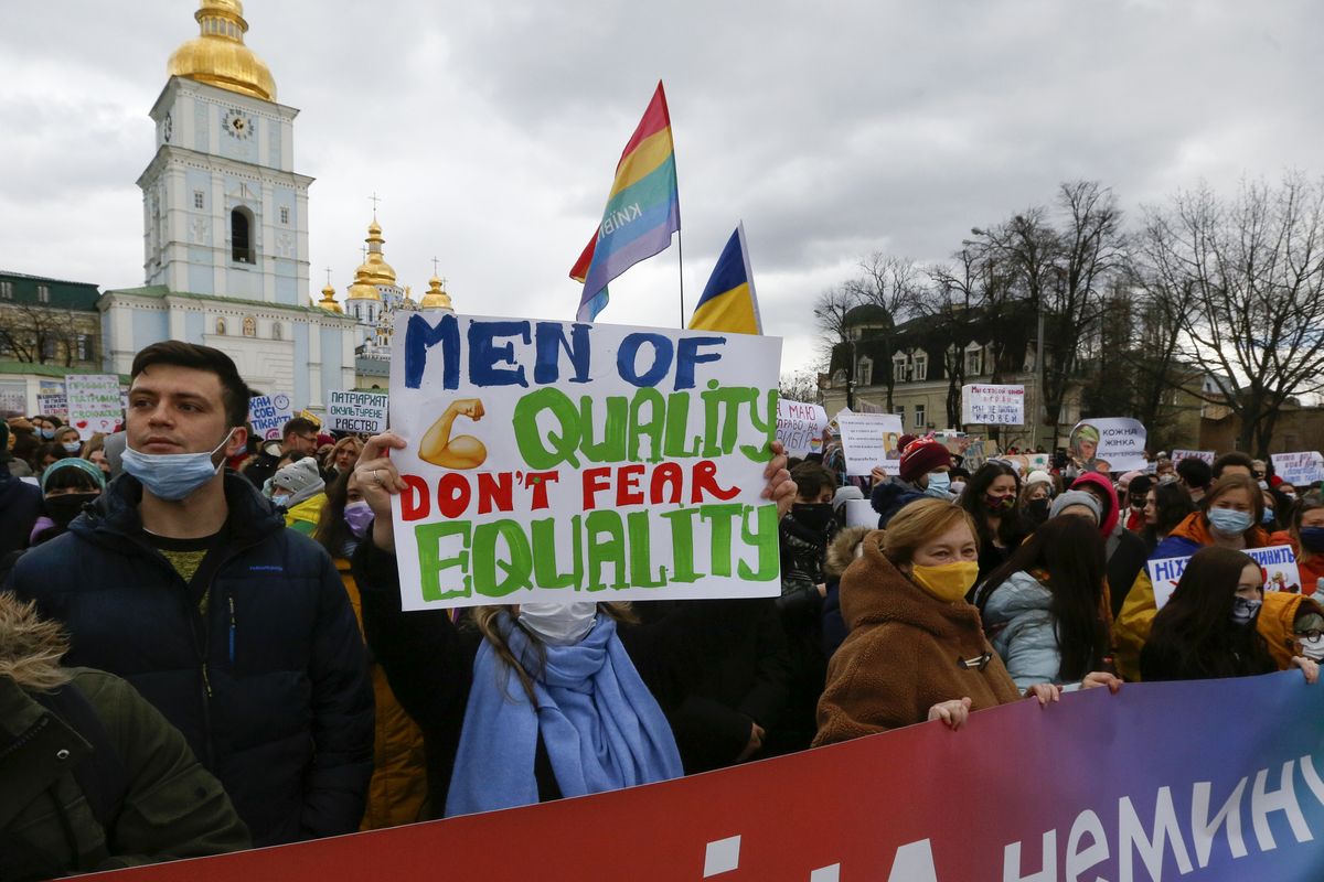 Activists shouts slogans at a rally on the occasion of the International Women