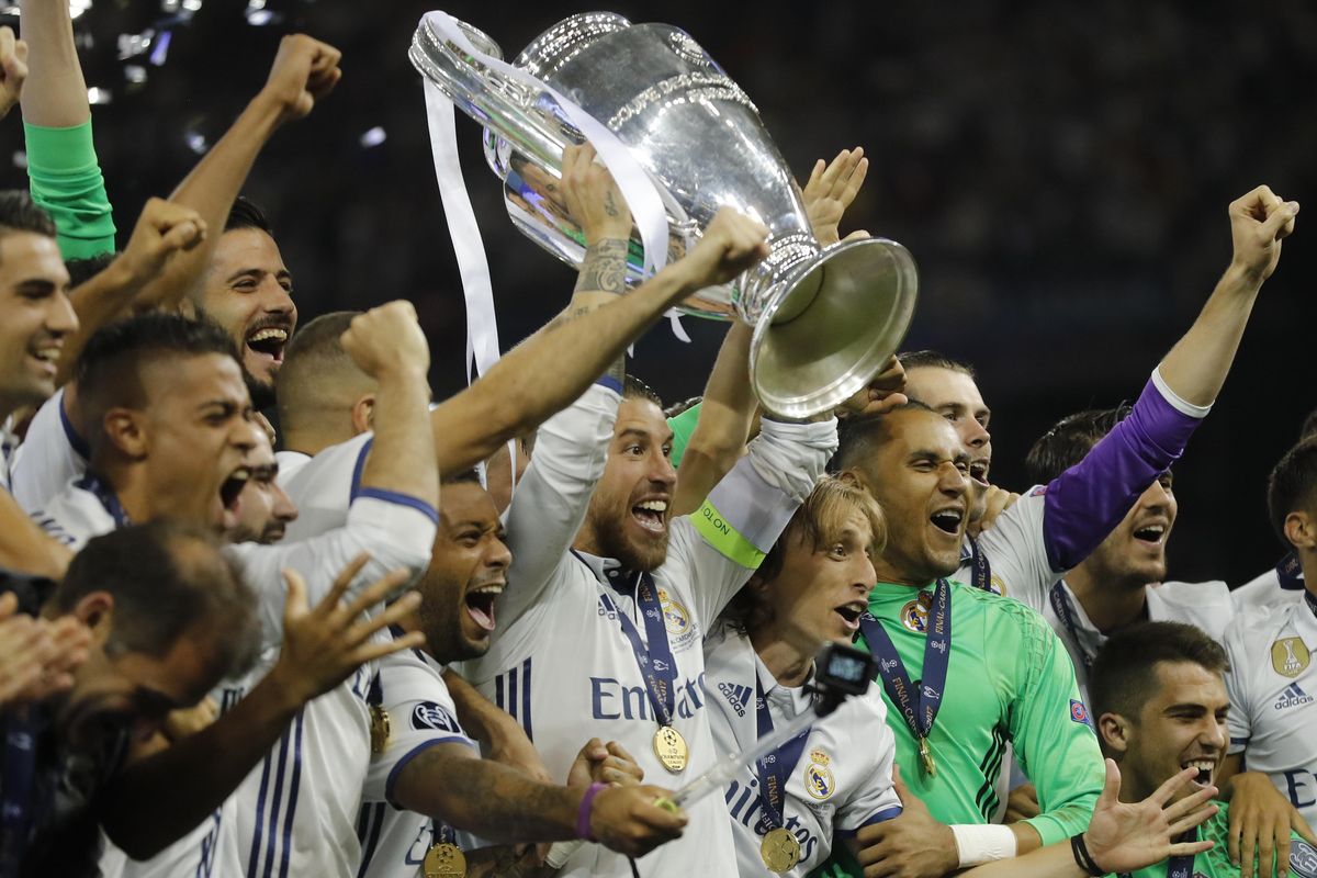 Real Madrid captain Sergio Ramos raises the trophy after the Champions League final soccer match between Juventus and Real Madrid at the Millennium stadium in Cardiff, Wales Saturday June 3, 2017. (Frank Augstein / Associated Press)