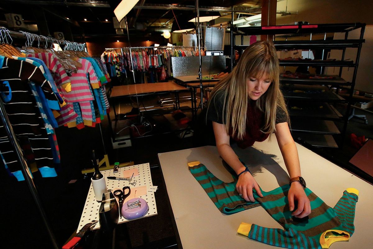 Jacey Frango, product stylist, prepares children's clothing to be photographed, Feb. 7, 2014, in Seattle.    (Mark Harrison/The Seattle Times/TNS)
