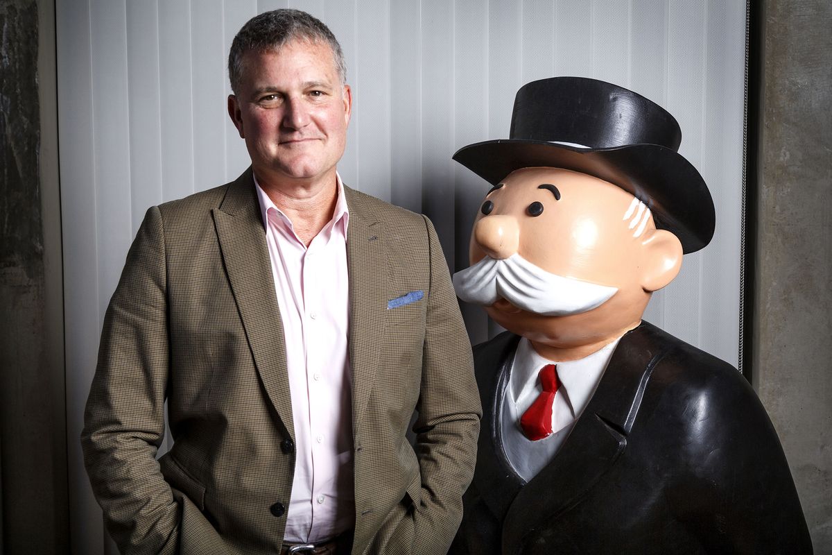 Hasbro Studios CEO Stephen Davis is photographed next to Mr. Monopoly at their headquarters in Burbank, Calif.