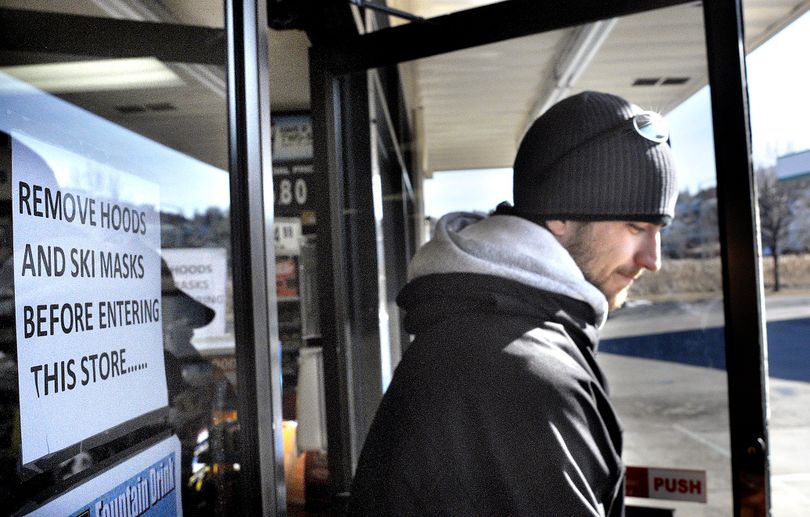 In this Feb. 22, 2010 photo, Kent Watkiss leaves the Noon�s store on the corner of Russell Avenue and 39th Street after purchasing a coffee Monday morning in Missoula, Mont. The store has adopted a 