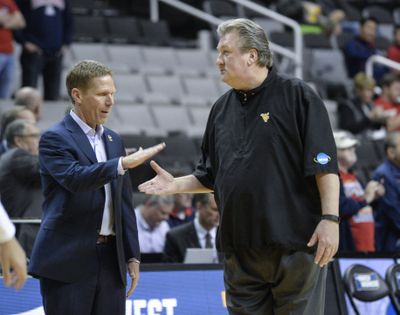 Gonzaga coach Mark Few greets West Virginia Bob Huggins before the first half of their NCAA Sweet Sixteen game, March 23, 2017, in San Jose. (DAN PELLE/The Spokesman-Review)