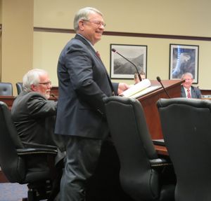 Idaho Secretary of State Lawerence Denney grins as he responds to questions from members of the House State Affairs Committee on Tuesday, Feb. 13, 2018, about campaign finance reform legislation proposed unanimously by an interim legislative committee. (Betsy Z. Russell)