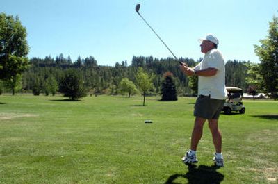 
The Spokesman-Review Russ Poole tees off at Rimrock Golf Course last month.
 (Jesse Tinsley / The Spokesman-Review)