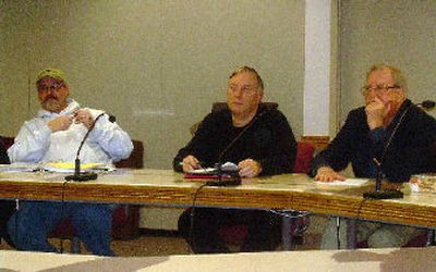 
From left, Sister City Association board members Dennis Ryan, Chuck Rehburg and Rol Herriges take part in a board meeting earlier this month. 
 (Cindy Hval / The Spokesman-Review)