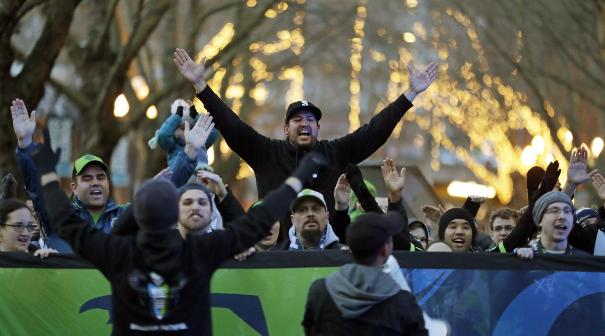 Seattle Sounders supporters take part in the traditional “March to the Match” before a CONCACAF Champions League soccer match against Santa Tecla, Thursday, March 1, 2018, in Seattle. (Ted S. Warren / Associated Press)