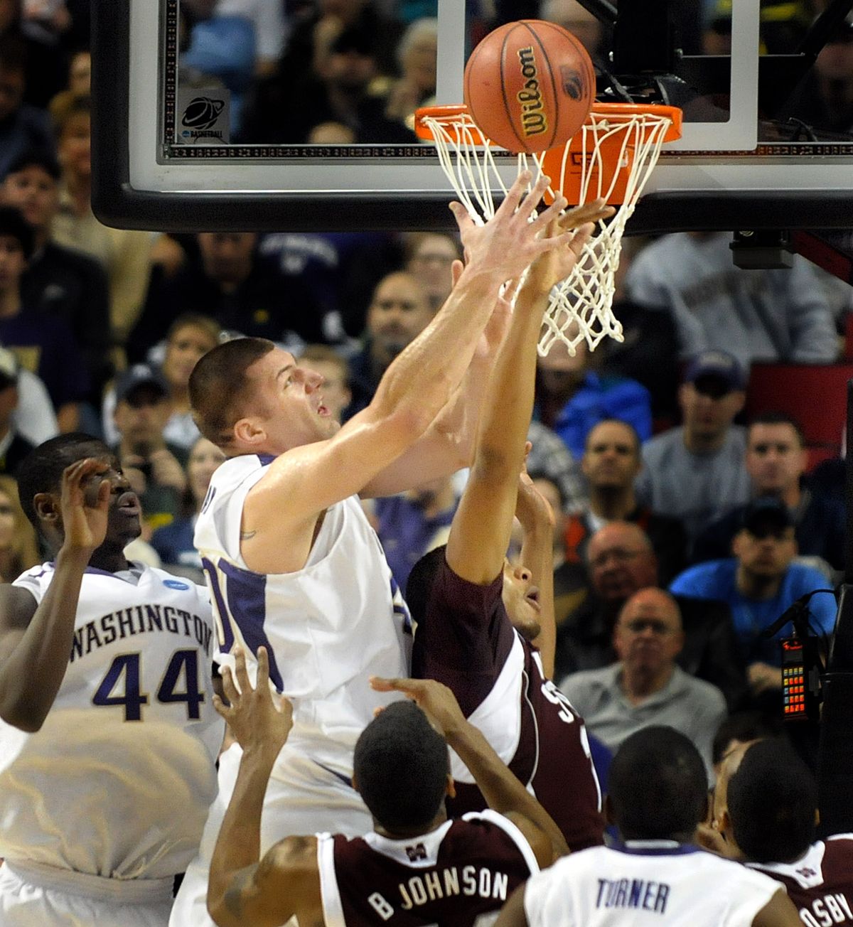 Washington’s Jon Brockman controls one of his game-high 14 rebounds against Mississippi State.  (Christopher Anderson / The Spokesman-Review)