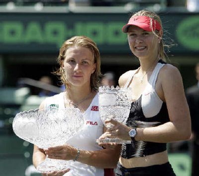 
Russians Svetlana Kuznetsova, left, and Maria Sharapova show off their Nasdaq-100 trophies.
 (Associated Press / The Spokesman-Review)