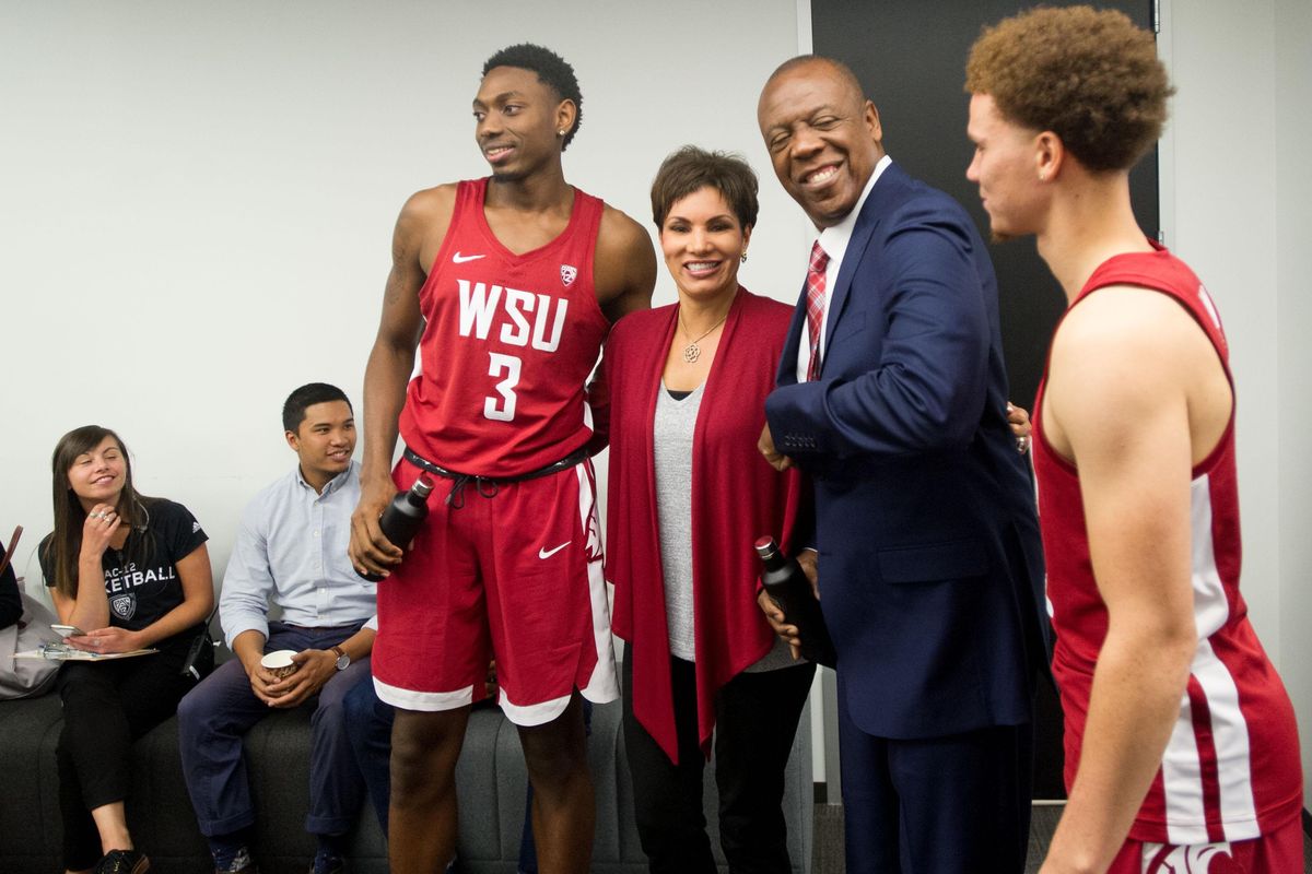 WSU head basketball coach Ernie Kent, center, laughs with players Malachi Flynn (22) and Robert Franks (3) before taking a group photo with WSU alumna and Pac-12 Network reporter and analyst Cindy Brunson after taking questions during Pac-12 Men’s Basketball Media Day on Thursday, October 12, 2017, at the Pac-12’s headquarters in San Francisco. (Tyler Tjomsland / The Spokesman-Review)