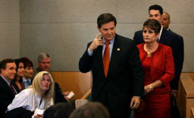 
Rep. Tom DeLay and his wife, Christine, walk out of the Travis County Courthouse in Austin, Texas, on Friday. DeLay appeared in court to face money laundering and conspiracy charges. 
 (Associated Press / The Spokesman-Review)