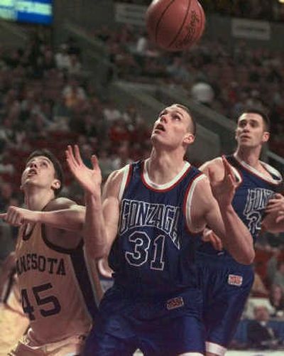 
Casey Calvary, center, Jeremy Eaton, right, got a break when they played GU's 1999 tourney opener in Seattle against Minnesota. Associated Press
 (Associated Press / The Spokesman-Review)