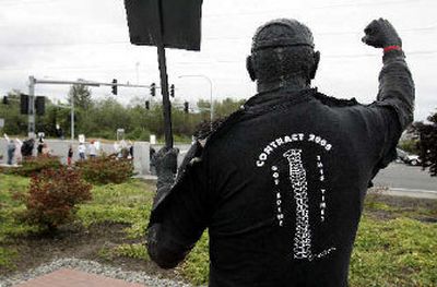
A statue of a striking Boeing worker wears a t-shirt that reads 