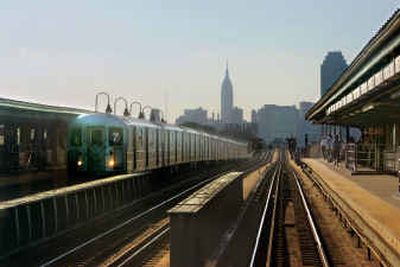
The skyline of the Manhattan borough of New York is visible from the 7 line subway train as it runs above ground in the Queens borough of New York in August. The Empire State Building is at center in the background and the United Nations building is at the horizon point at the end of the tracks, both in Manhattan. 
 (Associated Press / The Spokesman-Review)