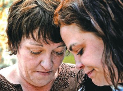 
Kim Mangis and her niece, Elizabeth Olson, console each other after telling their story of abuse and addiction. Mangis and her brother, Kristopher Olson, both say they were abused by priest Patrick O'Donnell. 
 (Jed Conklin / The Spokesman-Review)