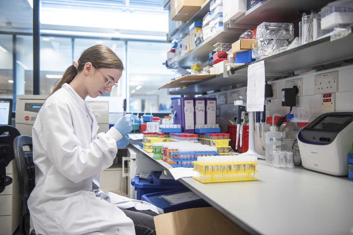 FILE - In this undated file photo issued by the University of Oxford, a researcher in a laboratory at the Jenner Institute in Oxford, England, works on the coronavirus vaccine developed by AstraZeneca and Oxford University. Britain on Wednesday, Dec. 30, authorized use of a second COVID-19 vaccine, becoming the first country to greenlight an easy-to-handle shot that its developers hope will become the “vaccine for the world.” The Department of Health said it had accepted a recommendation from the Medicines and Healthcare Products Regulatory Agency to authorize the vaccine developed by Oxford University and U.K.-based drugmaker AstraZeneca.  (John Cairns)
