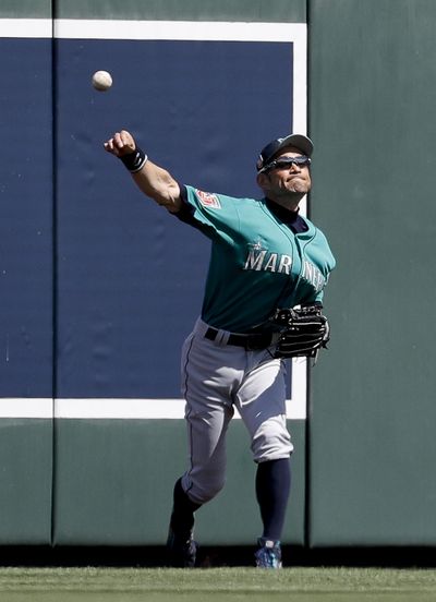Seattle Mariners right fielder Ichiro Suzuki, of Japan, fields a ball hit by Colorado Rockies’ DJ LeMahieu during the fifth inning of a spring baseball game in Scottsdale, Ariz., Tuesday, March 27, 2018. (Chris Carlson / Associated Press)
