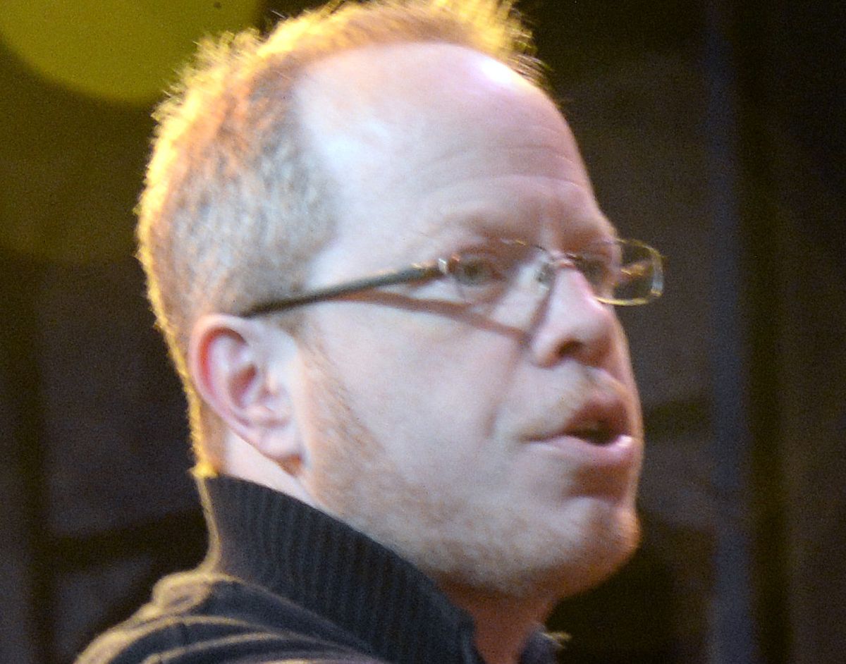 Keith Dixon, Spokane Civic Theatre’s new artistic director, organizes a scene from the theater’s production of “A Christmas Carol.”