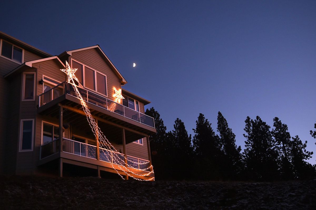 Stars light up the night from this Glennaire neighborhood South Hill home in Spokane on Tuesday, Dec. 6, 2016. (Kathy Plonka / The Spokesman-Review)