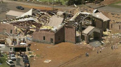 
People gather in front of the Southside Baptist Church in Damascus, Ark., after storms destroyed the building Friday. Associated Press
 (Associated Press / The Spokesman-Review)