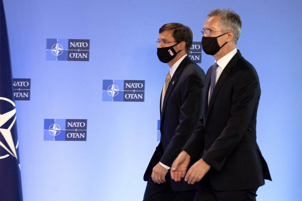 NATO Secretary General Jens Stoltenberg, right, walks with U.S. Secretary of Defense Mark Esper prior to a press conference at NATO headquarters in Brussels, Friday, June 26, 2020. U.S. Secretary of Defense Mark Esper is at NATO to follow-up on a broad range of issues raised during last week