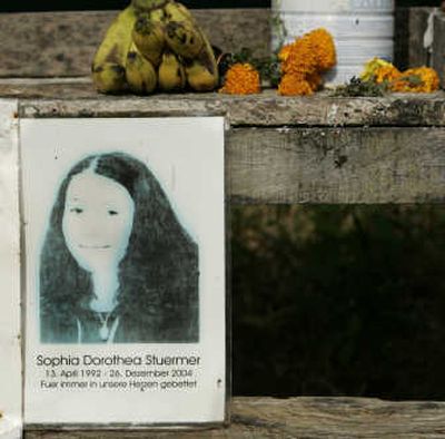 
A fading photo of a tsunami victim rests near a  site Tuesday,  in Khao Lak, Thailand. More than 5,000 people died in Thailand on Dec. 26, 2004. Associated Press
 (Associated Press / The Spokesman-Review)