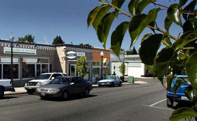 
Construction workers are renovating two buildings along South Perry at 10th. John Stellwagen and family have purchased two historic buildings and are hoping to attract a restaurant and retail shop. 
 (Christopher Anderson/ / The Spokesman-Review)