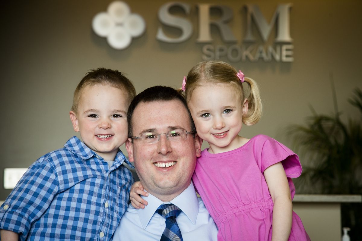 Dr. Tom Fisher with SRM Spokane, a fertility clinic, helps couples get pregnant with a variety of fertility treatments. He and his wife, Lisa, ended up needing fertility treatments. Today they have twin 4-year-olds, Henry, left, and Grace. They also have a new baby due next month. (Colin Mulvany)