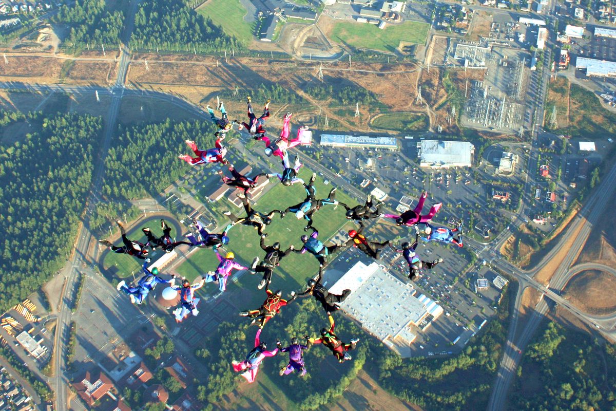 Sky divers are seen in a formation over Western Washington.