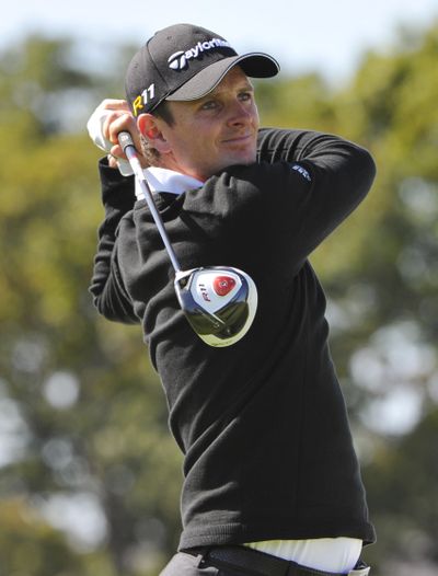 Justin Rose follows through on his tee shot on the 10th hole Thursday during the opening round of the BMW Championship. (Associated Press)