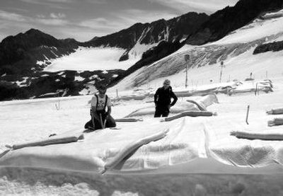 
Marc Olefs, left, and Andrea Fischer,  Innsbruck University researchers, check a field of the Stubai glacier  near the village of Neustift-im-Stubaital, Austria,  on July 4, 2005. 
 (File Associated Press / The Spokesman-Review)