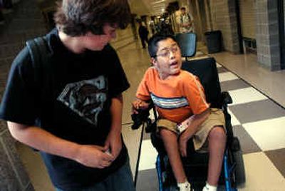 
Kaipo Manners chats at lunchtime with freshman Zachary Mason, who asked him for help finding a classroom on the first day of school at University High School. 
 (Holly Pickett photos/ / The Spokesman-Review)