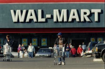 
Shoppers leave the Wal-Mart store in Lebanon, Ore.Associated Press
 (Associated Press / The Spokesman-Review)