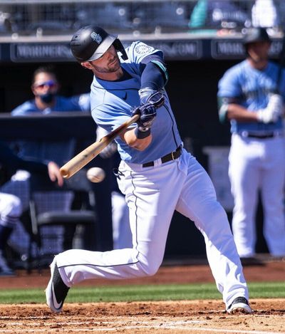 Mitch Haniger singles in his first plate appearance snce returning from injury. The San Diego Padres played the Seattle Mariners in the first Spring Training game of the 2021 season Sunday, February 28. 2021 at the Peoria Sports Complex in Peoria, AZ.  (Dean Rutz / Seattle Times)