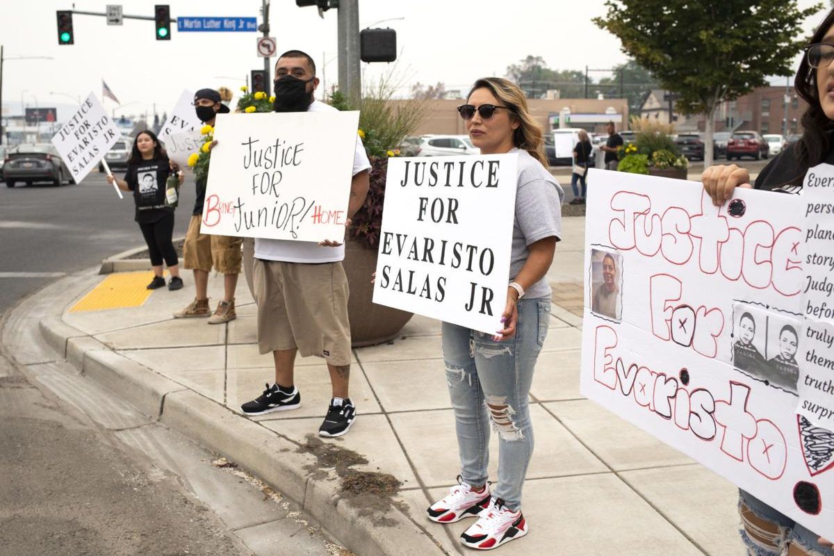 Evaristo Junior Salas’ sister Debbie Salas, center, rallies with friends and family members in front of Yakima County District Court in support of her brother on Friday in Yakima, Wash.  (Evan Abell/Yakima-Herald Republic)