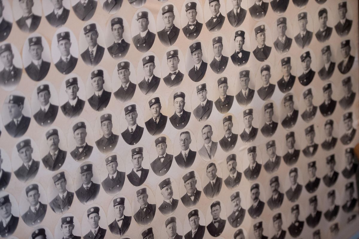 Portraits of Spokane firefighters, circa 1914, are seen with other memorabilia on  Jan. 24 at the Spokane Fire Department Training Center in Spokane. (Tyler Tjomsland / The Spokesman-Review)