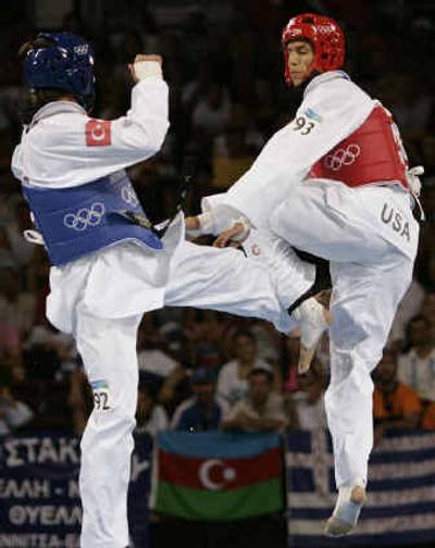 
Steven Lopez, right, from the United States, competes against Bahri Tanrikulu, from Turkey.
 (Associated Press / The Spokesman-Review)