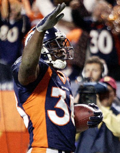 
Broncos running back Mike Anderson salutes the crowd after scoring his second touchdown. 
 (Associated Press / The Spokesman-Review)