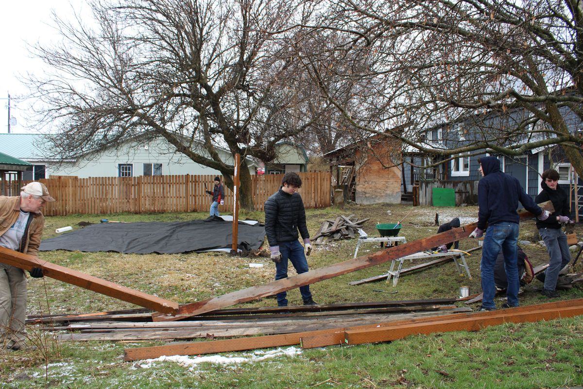 Barry Bacon and students from Upper Columbia Academy assist with the transitional housing project Bridges of Hope on Monday in Colville. (Monica Carrillo-Casas/The Spokesman-Review)