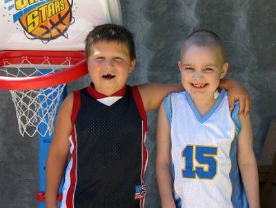 
Patients, Skyyler Barron, right, and Coulter Myers shown in August 2006 while staying at the Ronald McDonald House. Myers died two months later.
 (Courtesy Michael Forness / The Spokesman-Review)