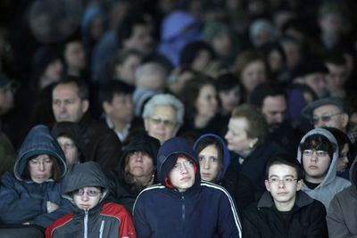 Audience members listen to Nobel Prize winner and Holocaust survivor Elie Wiesel speak during the grand opening of the Illinois Holocaust Museum and Education Center on Sunday in Skokie, Ill.  (Associated Press / The Spokesman-Review)