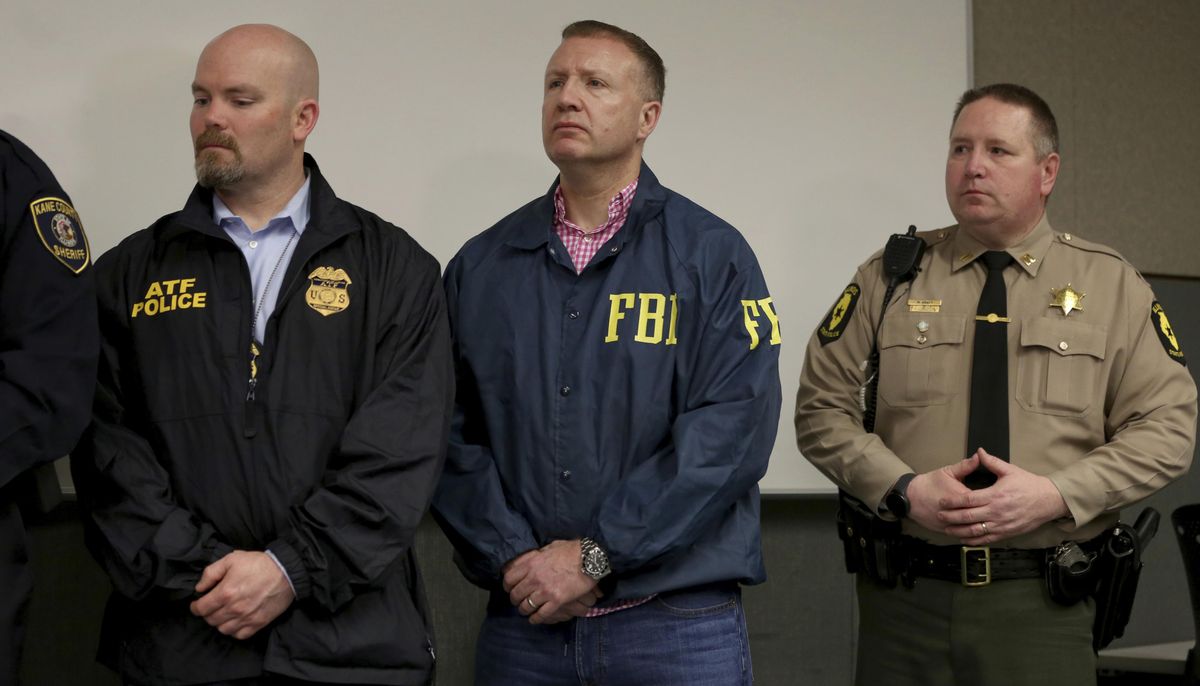 Representatives of law enforcement agencies attend a news conference Friday, Feb. 15, 2019, in Aurora, Ill., after shootings at a manufacturing company in the city. Several people were killed and several police officers injured, police say, before the gunman, an employee of the company, was fatally shot. (Patrick Kunzer / AP)