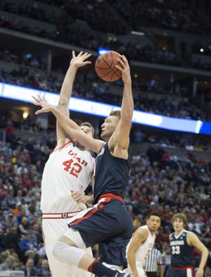 GU's Domantas Sabonis drives on Utah's Jacob Poelti in the first half at the Pepsi Center, March 19, 2016, to play Utah in the NCAA Second Round in Denver, Co. (Dan Pelle / The Spokesman-Review)