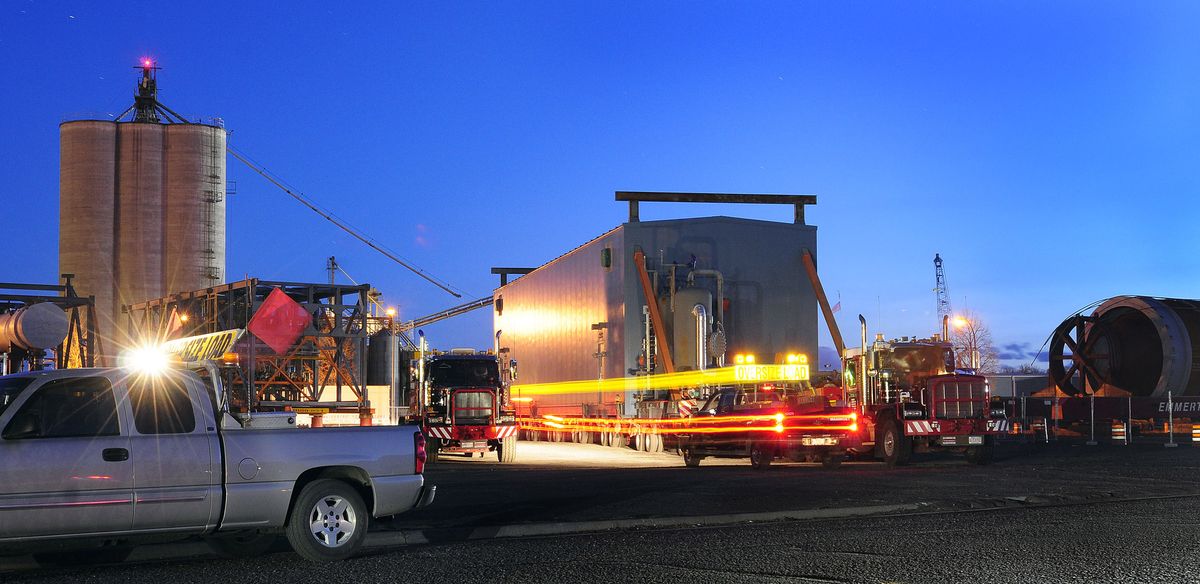 In this April 11, 2011 photo, activity around the Imperial Oil test module increases as crews prepare to depart from the Port of Lewiston. The module, which is 250 feet long, 30 feet tall, 24 feet wide and weighs almost 500,000 pounds, will be the first of many the oil company hopes will travel the route on its way to the Kearl Oil Sands project in Alberta, Canada. (Kyle Mills / Lewiston Tribune)