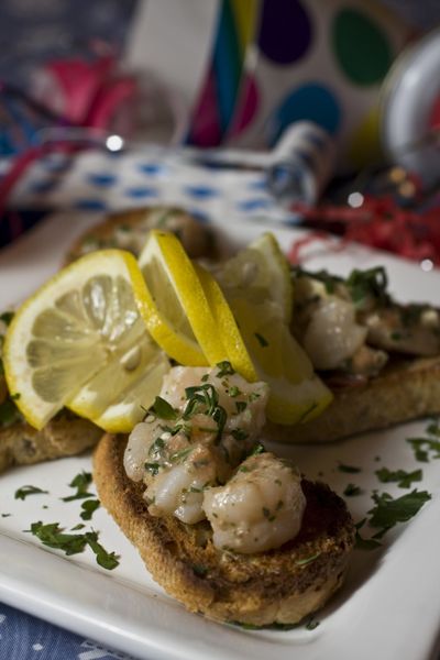 By lowering the fat and calories while keeping the flavor these Shrimp and Pesto Crostini will be a hit without the guilt.  (Associated Press / The Spokesman-Review)