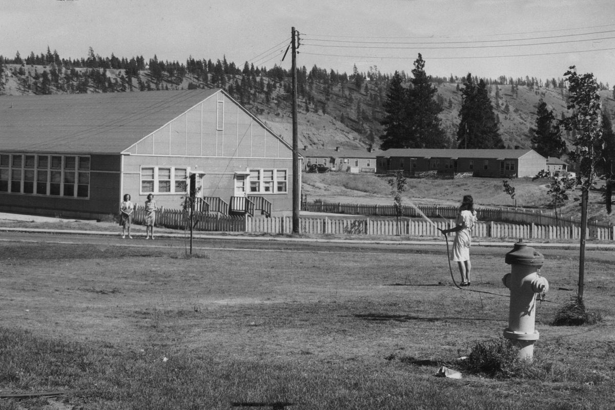 1946: The war was over but the residents of the Victory Heights housing project continued living in the barracks-style buildings thrown up hastily in 1943-1945. At left is a school building. The Public Housing Authority was waiting for local housing crunch to ease up before retiring the aging buildings of Victory Heights and Coplen Park in Hillyard, which were finally hauled away in 1958 and the parcels sold off. Some buildings, like the tidy bungalows in Garden Springs Terrace, were left in place and eventually sold to individual owners. (SPOKESMAN-REVIEW PHOTO ARCHIVE / SR)
