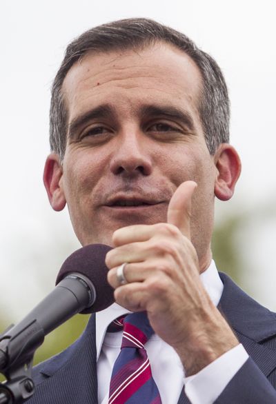 Los Angeles Mayor Eric Garcetti speaks Saturday at Martin Luther King Jr. Park in Los Angeles. (Associated Press)