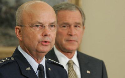 President Bush listens to Air Force Gen. Michael Hayden speak Monday in the Oval Office after he announced Hayden as his choice to replace outgoing CIA Director Porter Goss.
(Associated Press / The Spokesman-Review)