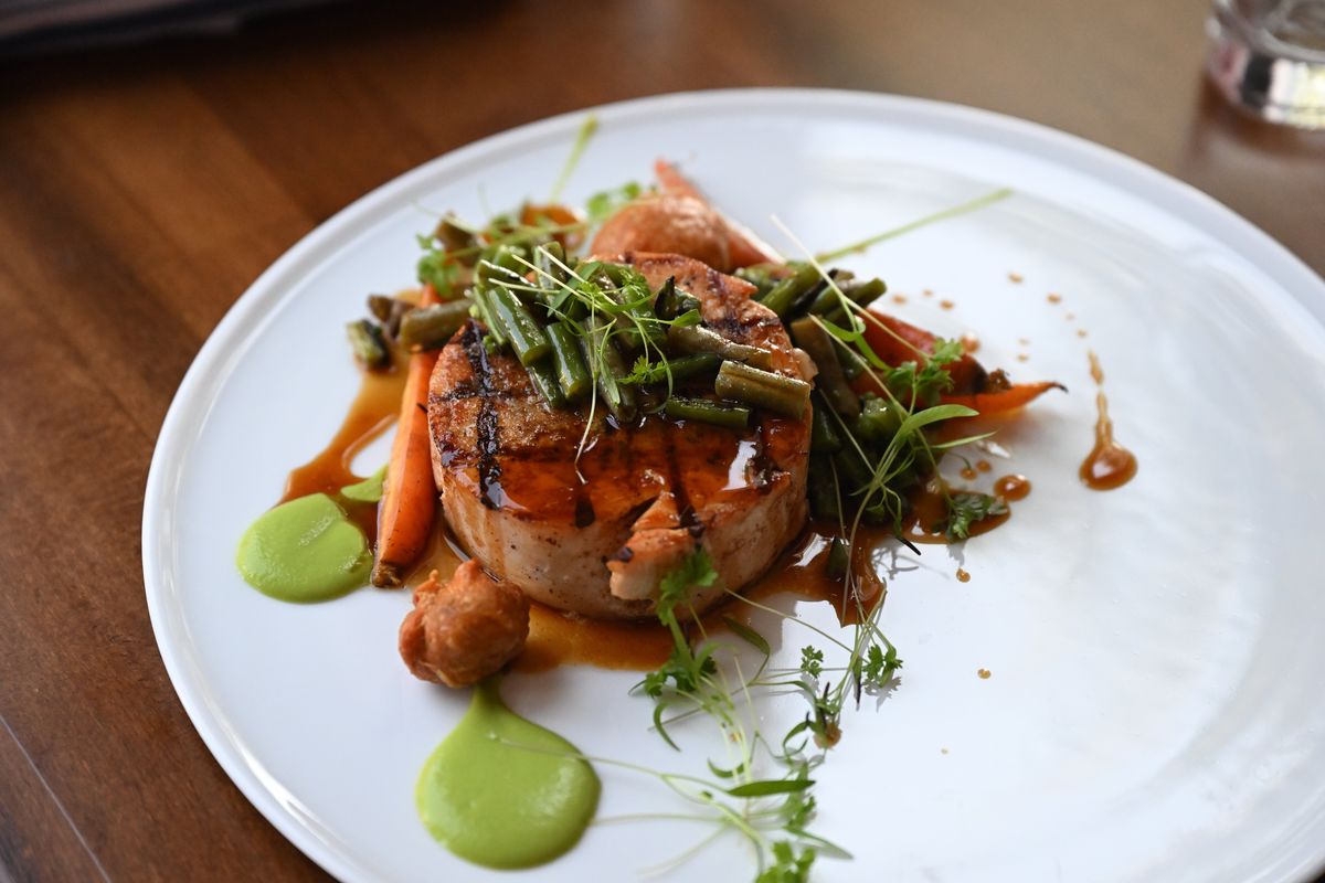 Chef de cuisine Shaun Ratty prepared this signature chicken dish featuring a flavorful mixture of chicken and other flavors in a patty at a new French restaurant, simply named Bowery, at 230 W. Riverside, Avenue, which some may remember as the dive bar and record store called Garageland. It's a now an open, well-lit space with a French cuisine menu.  (Jesse Tinsley/The Spokesman-Review)
