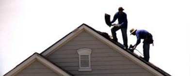 Roofers put the finishing touches on a new house under construction. Nationwide, existing-home sales are expected to fall 5.7 percent to 6.67 million in 2006 from the record 7.08 million last year. 
 (AP / The Spokesman-Review)