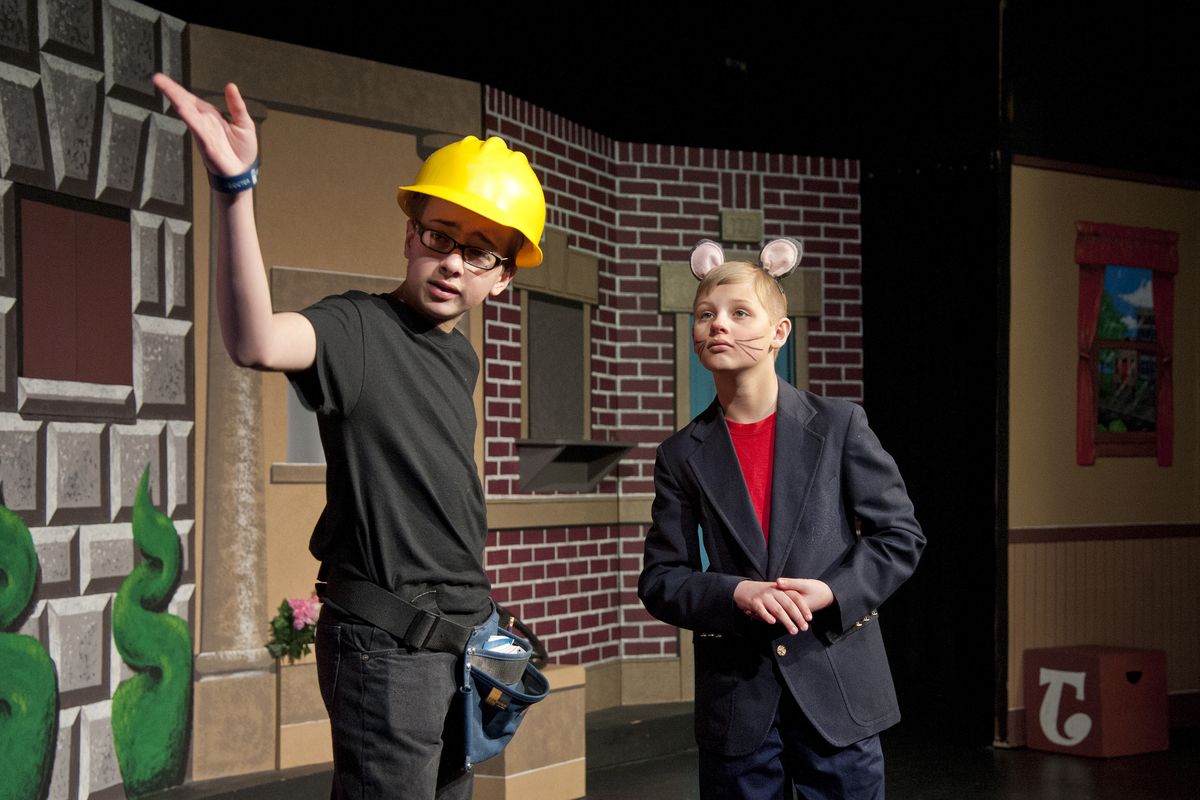 Taylor Jennings, as Stuart Little, right, asks for help to find his bird from Noah Hilderbrand, as the repairman, in a scene from the Spokane Children’s Theatre production of “Stuart Little.” (Dan Pelle)